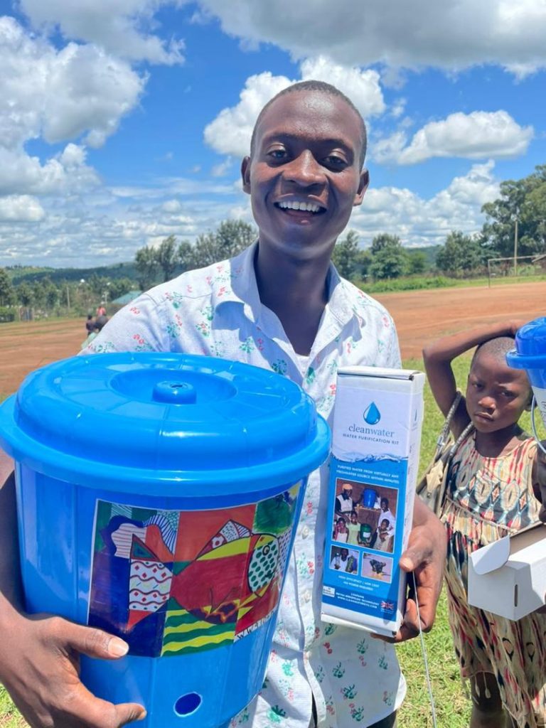 Lifewater Distribution in Kyaka II Refugee Settlement - happy recipient
